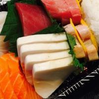 Sashimi · Eight pieces sashimi chef's choice and one spicy tuna roll.