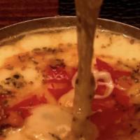 Provoleta A La Parrilla.. · Grilled Italian Provolone Cheese au Gratin, topped with freshly chopped tomato, olive oil, o...
