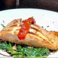 Salmon. · Grilled Salmon, marinated in chimichurri. Served in a bed of sautéed spinach w/white rice of...