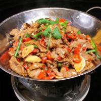 Dry Pot Lamb / 干锅羊 · Served in a sizzling mini wok and cooked in a spicy hot pot sauce with black mushrooms, bamb...