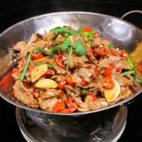 Dry Pot Chicken / 干锅鸡 · Served in a sizzling mini wok and cooked in a spicy hot pot sauce with black mushrooms, bamb...