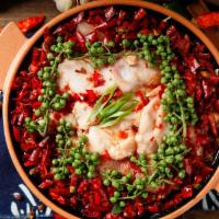 Spicy Hot Pot Fish Fillet / 冷锅鱼片 · Served in a hot pot. Flavorful thin sliced meat is boiled in a soup base with various kinds ...