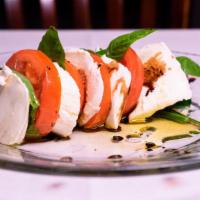 Caprese · Fresh made mozzarella, Roma tomato slices, and basil, EVOO, with aged balsamic.