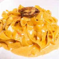 Fettuccine Selvaggia · Fresh pasta, imported porcini mushrooms, and jus cream sauce.