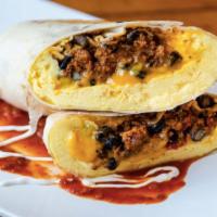 El Guapo Burrito · Chorizo, black beans, scrambled eggs, cheddar, ranchero salsa, crema, jalapenos, and pickled...