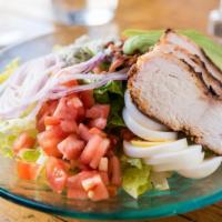 Cobb Salad · Romaine, grilled chicken, bacon, avocado, blue cheese, hard boiled egg, tomato, onion, and b...