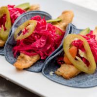 Fish Tacos · Beer battered tilapia, avocado, pickled cabbage, jalapeños, and chipotle aioli.