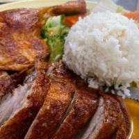 Chu Chee Duck ** · Medium spicy. Crispy roasted semi-boneless duck served with red curry sauce and flavored wit...
