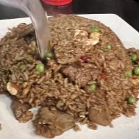 Nasi Goreng · Choice of shrimp, chicken and beef fried rice with Malaysia shrimp paste, green peas, red pe...