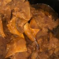 Beef Rendang · Tender pieces of beef simmered with exotic spices, cinnamon, cloves and lemongrass in coconu...
