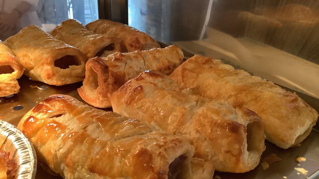 Sausage Roll · House made banger, puff pastry, brown sauce.