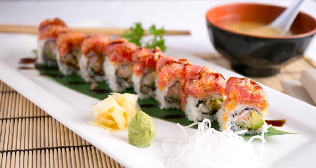 Newbury Maki (8 Pieces) · Served raw. Salmon, avocado, tobiko and tempura flakes topped w/ a layer of spicy crab stick and squid, grilled to the perfection.