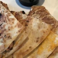 Panache Chicken Quesadilla · Tender chicken topped with monterey jack and cheddar cheese.