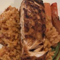 Salmon · Grilled scottish salmon served over risotto paprika in a lobster broth.