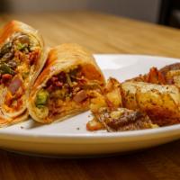West Coast Breakfast Burrito · Ham, cheddar cheese, peppers, onions, bacon and avocado with scrambled egg and spicy aioli. ...