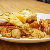 Classic Benedict · 2 poached eggs with choice of meat  on a English muffin topped with homemade hollandaise