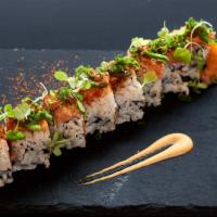 Sakana Roll · Inside: spicy tuna, mango. Outside: seared salmon, jalapeño, scallion. Sauce: crunchy sesame...