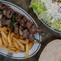 Two Skewers Lamb Shish Kebab Dinner · Two skewers lean lamb kebab .  served with Greek salad + 1 side of your choice