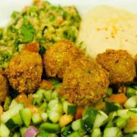 Falafel Dinner  · mixed salad base on top 6 pc falafel  humus, tabbouleh, shepherd salad side of yogurt and hu...