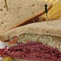 Reuben Sandwich · Corned beef, pastrami, or turkey breast. Served with Swiss cheese, sauerkraut, and Russian d...
