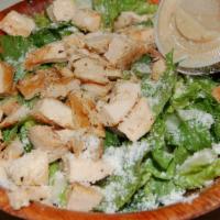 Grilled Chicken Caesar Salad · Marinated breast of chicken over romaine lettuce and croutons with caesar dressing.