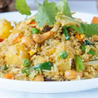 Crab Fried Rice · Lump crab meat with peas, carrot, tomato, egg and onion in our special seafood flavored rice.