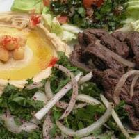 Lamb Shawarma Plate · Tender lamb shawarma served with basmati rice, side salad, fresh pita and your choice of sau...