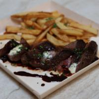 Steak Frites · Butchers cut of beef - herbed butter - red wine jus - fries.