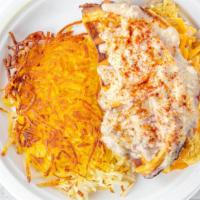 Sage & Sausage · Stuffed with scrambled eggs, sausage and cheese, then smothered with country gravy. Served w...