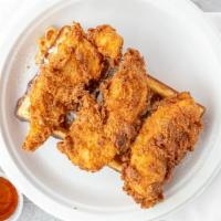 Mama Deb'S Original Fried Chicken Tenders · Three pieces of succulent southern fried chicken tenders on an American classic waffle. Serv...