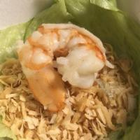 Thai Shrimp Green Wraps · Thai mieng kum. Shrimp tossed with sweet thai chili sauce, minced; lime, scallions, red onio...