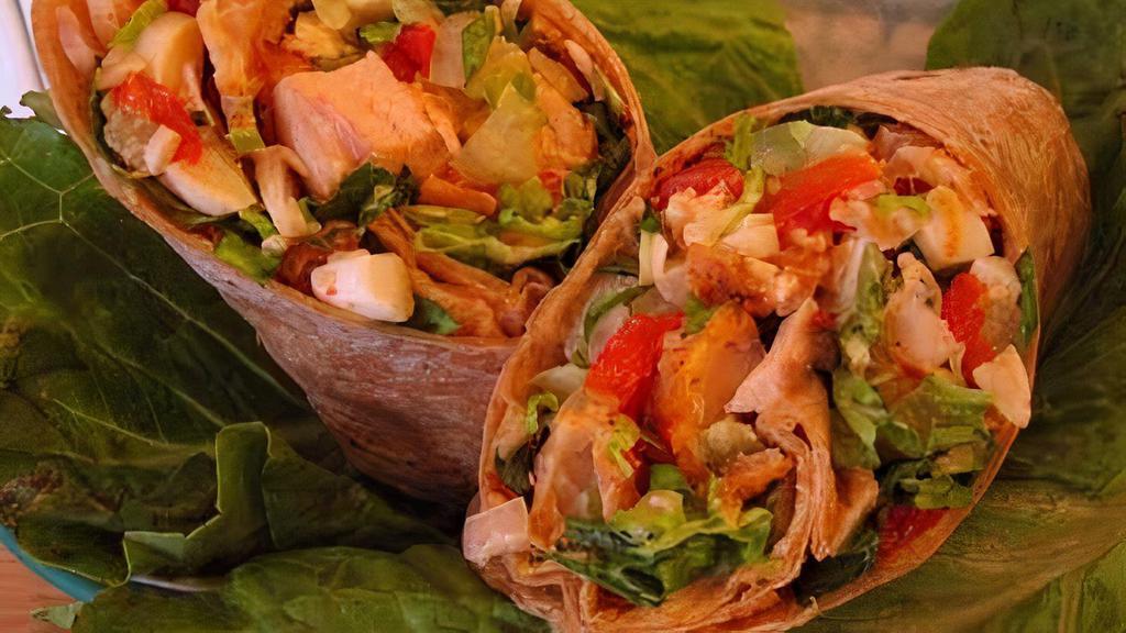 Vegetarian Wrap · Green peppers, onions, mushrooms, broccoli, spinach, lettuce and tomatoes. Served with chips, lettuce and tomatoes.