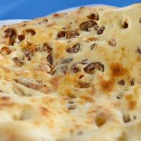 Apricot Date Naan · Unleavened homemade bread stuffed with fresh apricots and dates.