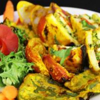 Tandoori Paneer Tikka · Chunk of cottage cheese marinated with yogurt and spices, cooked in tandoor.