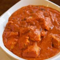 Chicken Tikka Masala · Cubes of white meat chicken gently spiced and cooked in a rich creamy tomato gravy.