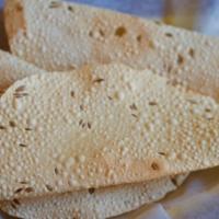Papadum · Crispy crepe lentil bread, very thin.