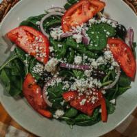 Spinach Salad · Baby spinach, tomatoes, red onions, kalamata olives, Gorgonzola cheese, and balsamic dressing.