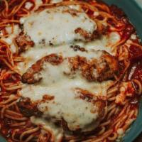 Chicken Parmesan · Marinara and breaded chicken tenders served over spaghetti and melted mozzarella cheese. Ser...
