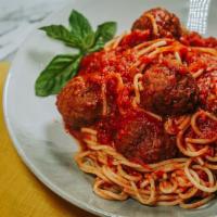Spaghetti With Meatball · Marinara and beef meatballs served over spaghetti.Served with Garlic Bread.
