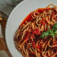 Spaghetti With Meat Sauce · Marinara and ground beef sauce served over spaghetti. served with a slice of Asiago cheesy b...