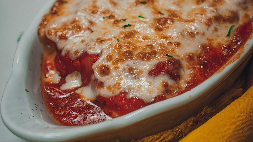 Cheese Manicotti · Pasta stuffed with ricotta and mozzarella baked in marinara, topped with more mozzarella. Served with a slice of Asiago cheesy bread.