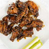 Jerk Sauce Wing Ding · 6 pieces. Chicken wing dings with celery and ranch or blue cheese dressing.
