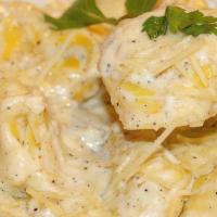 Whole Portion Tortellini Alfredo · Pasta filled with ricotta and Romano cheese. Served with side salad and garlic knots.