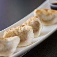 Pan Fried Dumplings · Handmade in house w/ pork. Steamed option available by request.