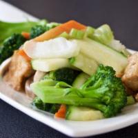 Vegetarian Delight · Fried tofu sauteed w/ fresh vegetables in a white sauce. Brown sauce or steamed option avail...