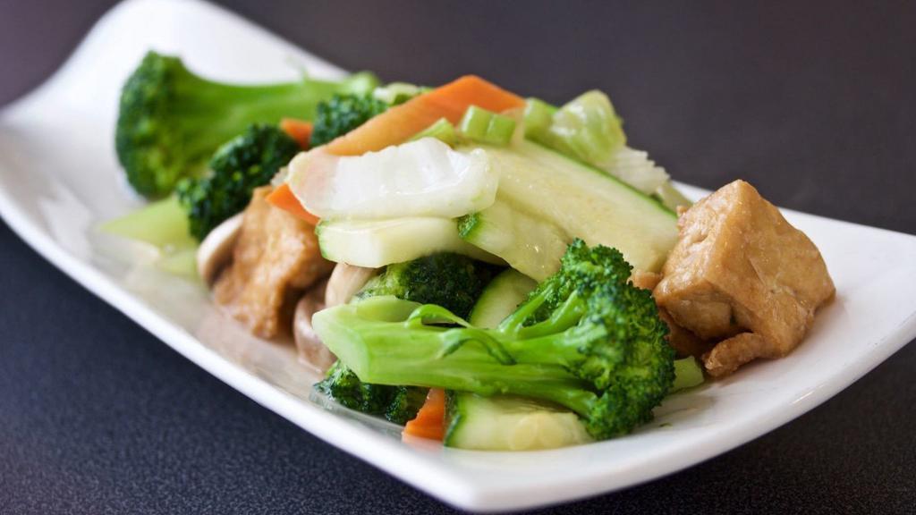 Vegetarian Delight · Fried tofu sauteed w/ fresh vegetables in a white sauce. Brown sauce or steamed option available by request.