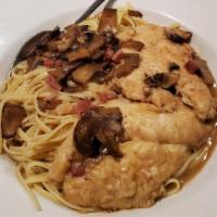 Chicken Marsala · Sautéed chicken, mushrooms, prosciutto, and marsala Demi glaze over linguini fini.