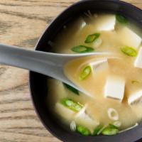 Miso Soup · Miso broth with crabmeat, scallions, and dry seaweed.