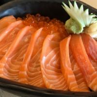 Salmon Don · Sliced raw salmon over a bed of sushi rice.