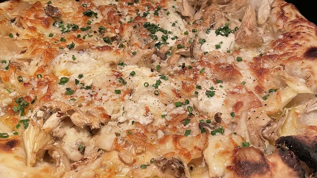 Mushroom Pizza · Roasted garlic, smoked mozzarella, caramelized onion.